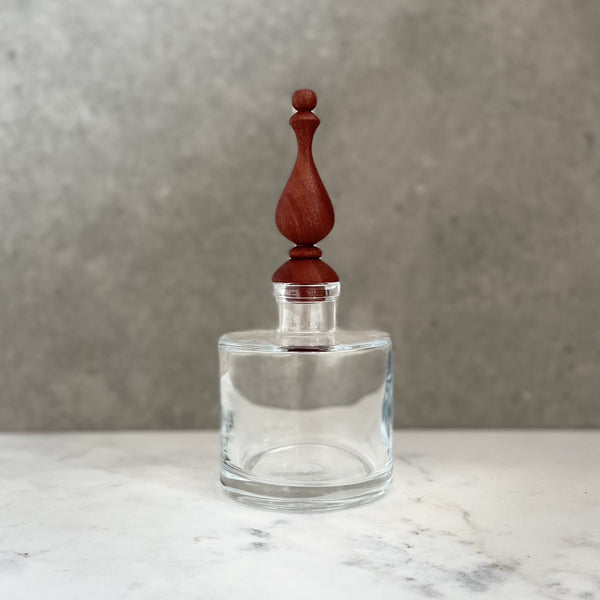 Glass bottle with bespoke handcrafted wooden stopper