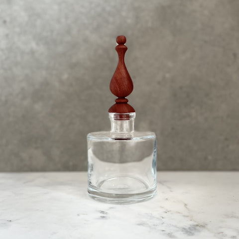 Glass bottle with bespoke handcrafted wooden stopper