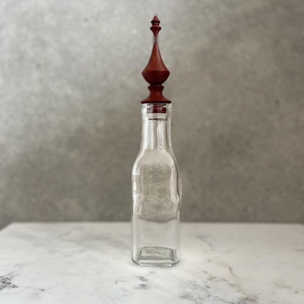 Glass bottle with bespoke handcrafted wooden stopper