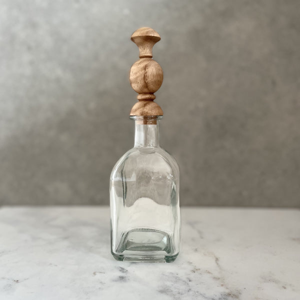 Glass bottle with bespoke handcrafted wooden stopper