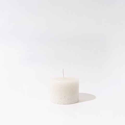Small handmade white cathedral candle