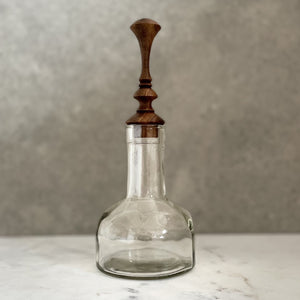 Glass bottle with bespoke handcrafted timber stopper
